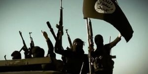 An image grab taken from a propaganda video released on March 17, 2014 by the Islamic State of Iraq and the Levant (ISIL)'s al-Furqan Media allegedly shows ISIL fighters raising their weapons as they stand on a vehicle mounted with the trademark Jihadists flag at an undisclosed location in the Anbar province. The jihadist Islamic State of Iraq and the Levant group has spearheaded a major offensive that began on June 9, 2014 and has since overrun all of Iraq's northern Nineveh province. AFP PHOTO / HO / AL-FURQAN MEDIA === RESTRICTED TO EDITORIAL USE - MANDATORY CREDIT "AFP PHOTO / HO / AL-FURQAN MEDIA" - NO MARKETING NO ADVERTISING CAMPAIGNS - DISTRIBUTED AS A SERVICE TO CLIENTS FROM ALTERNATIVE SOURCES, AFP IS NOT RESPONSIBLE FOR ANY DIGITAL ALTERATIONS TO THE PICTURE'S EDITORIAL CONTENT, DATE AND LOCATION WHICH CANNOT BE INDEPENDENTLY VERIFIED ===
