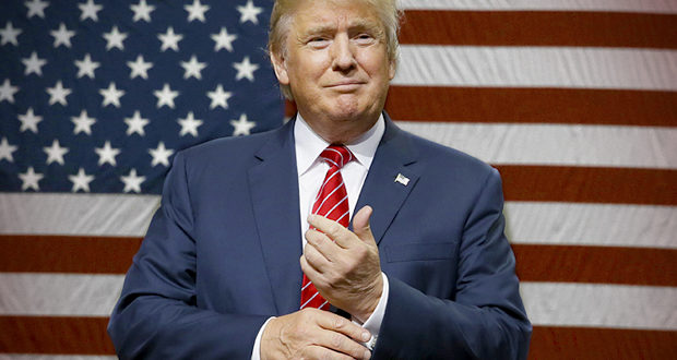 Republican presidential candidate Donald Trump speaks to supporters as he takes the stage for a campaign event in Dallas, Monday, Sept. 14, 2015. (AP Photo/LM Otero)